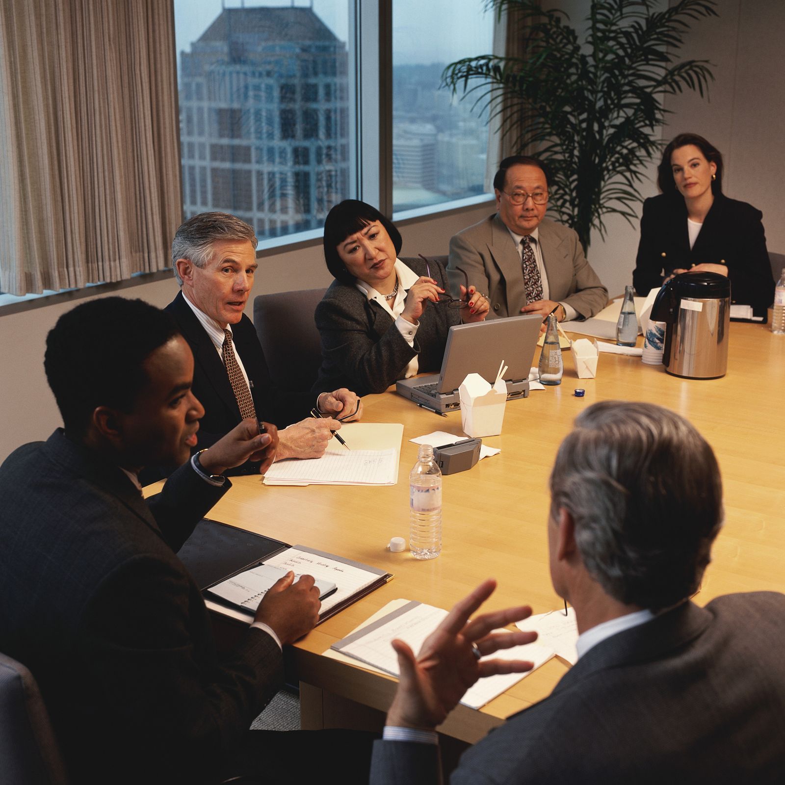 Business leaders around a boardroom table