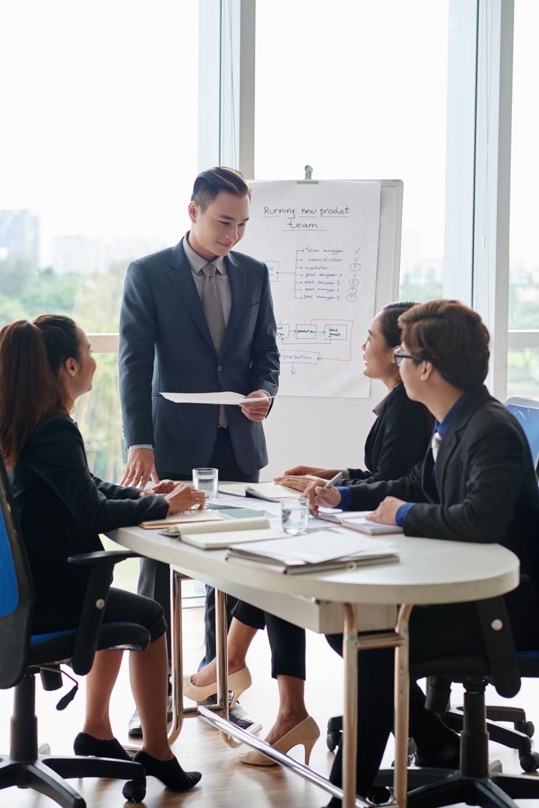 An MB&A-style client briefing in a meeting room