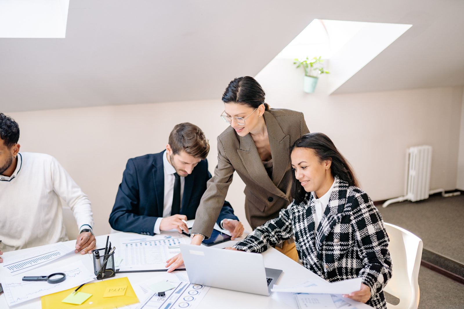 Accountants reviewing financial reports together at a meeting table